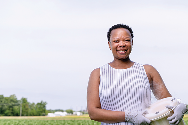 Thelma Madzima in a field